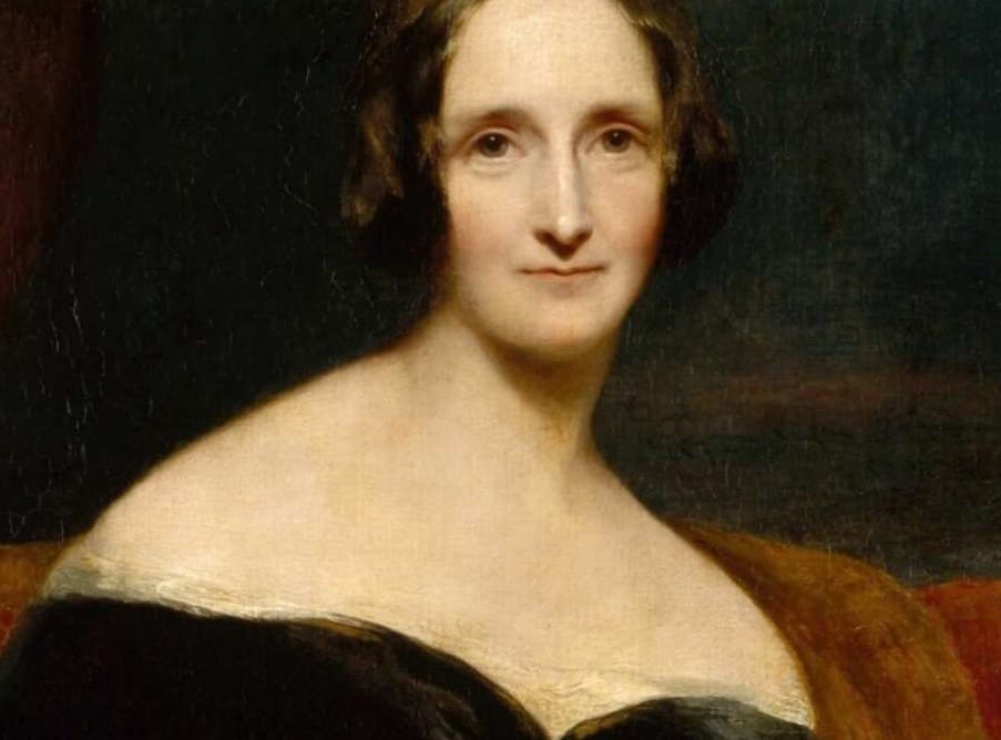 A portrait of a slim white woman with large brown eyes and a small, expressive mouth, a long aquiline nose. She is bare shouldered